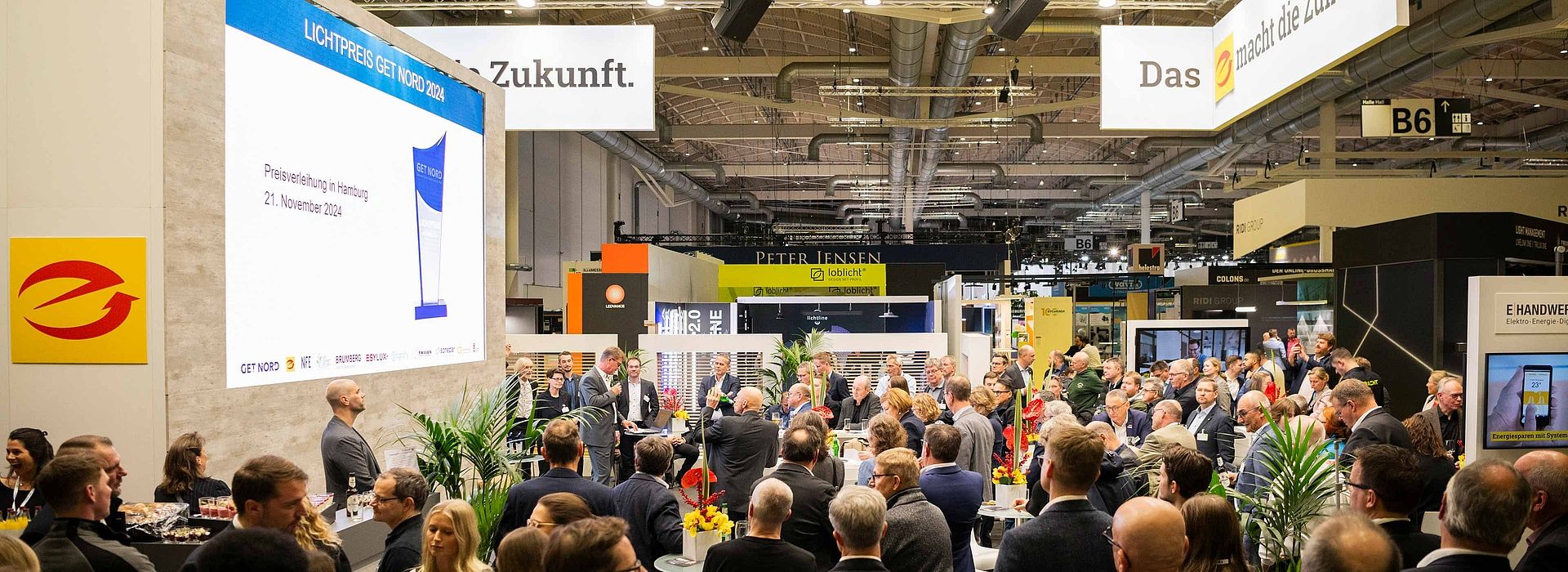 View of the stage of the Light Prize 2024. The audience looks at the speaker.